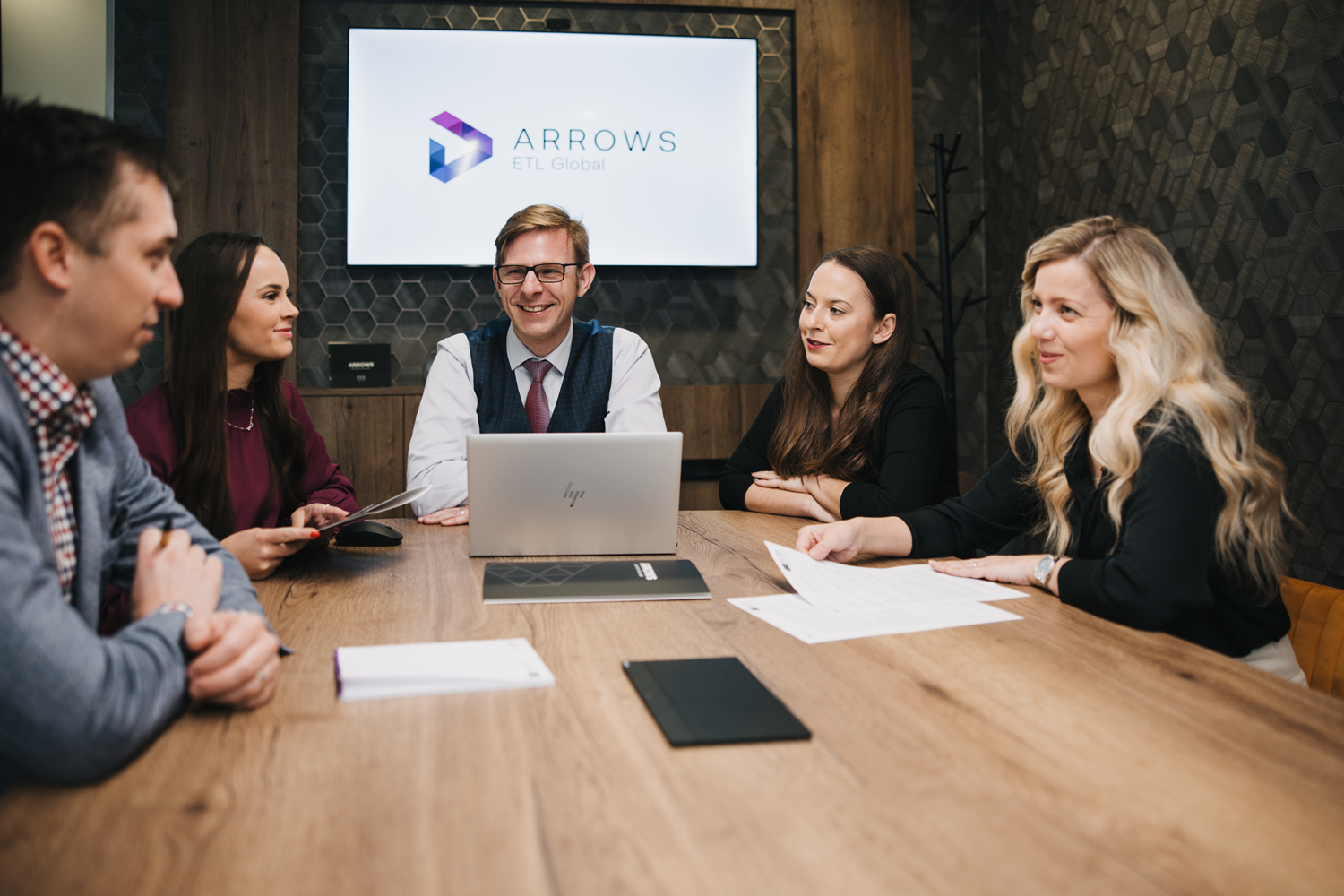 In the image, we see an expert consulting on a research collaboration agreement.